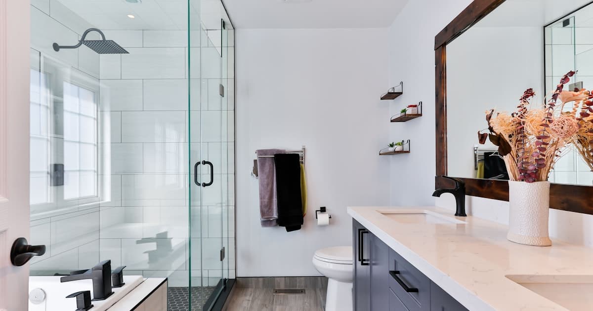 Before and after tub to shower conversion in modern bathroom